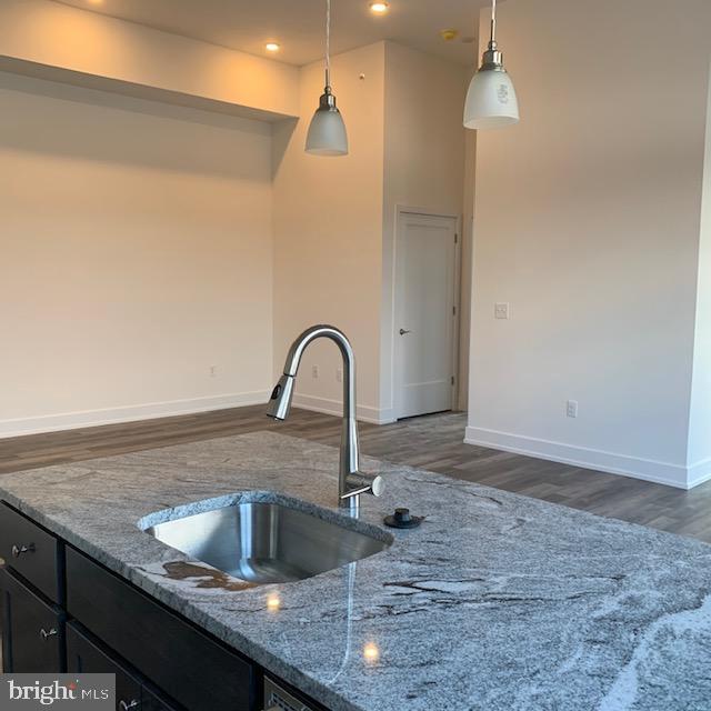 6164-66 Ridge Avenue, Unit 302 Philadelphia, PA 19128 - Photo 5 of 15 a kitchen with a sink a counter and window in it