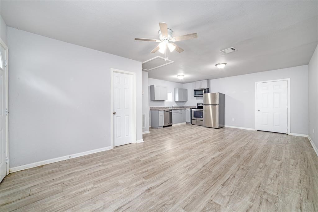 1309 Jefferson Street, Unit C Baytown, TX 77520 - Photo 2 of 9 a view of a kitchen with a sink and a window