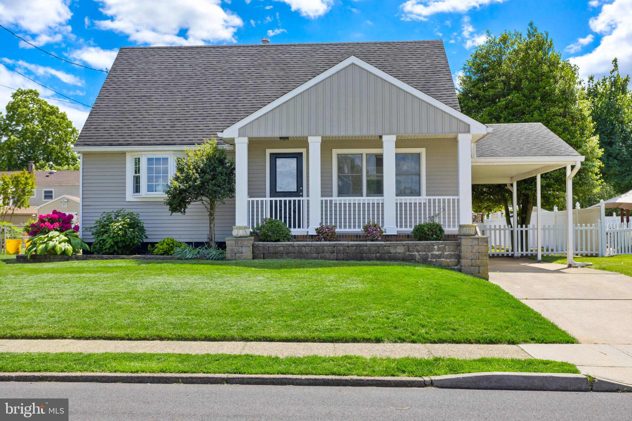 124 Gary Drive Hamilton, NJ 08690 - Photo 2 of 31 a front view of a house with a yard and porch