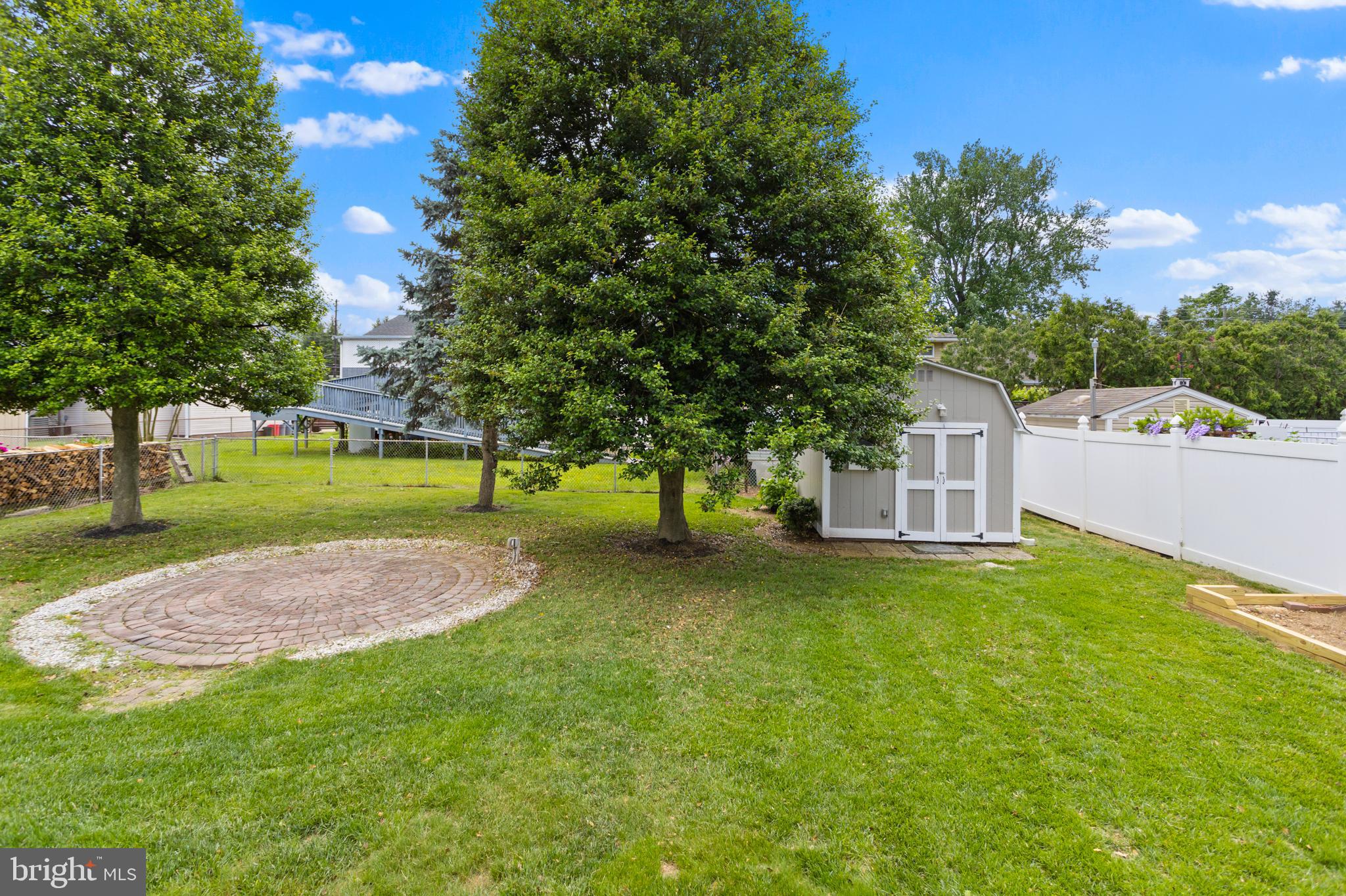124 Gary Drive Hamilton, NJ 08690 - Photo 30 of 31 a view of a tree in front of a house