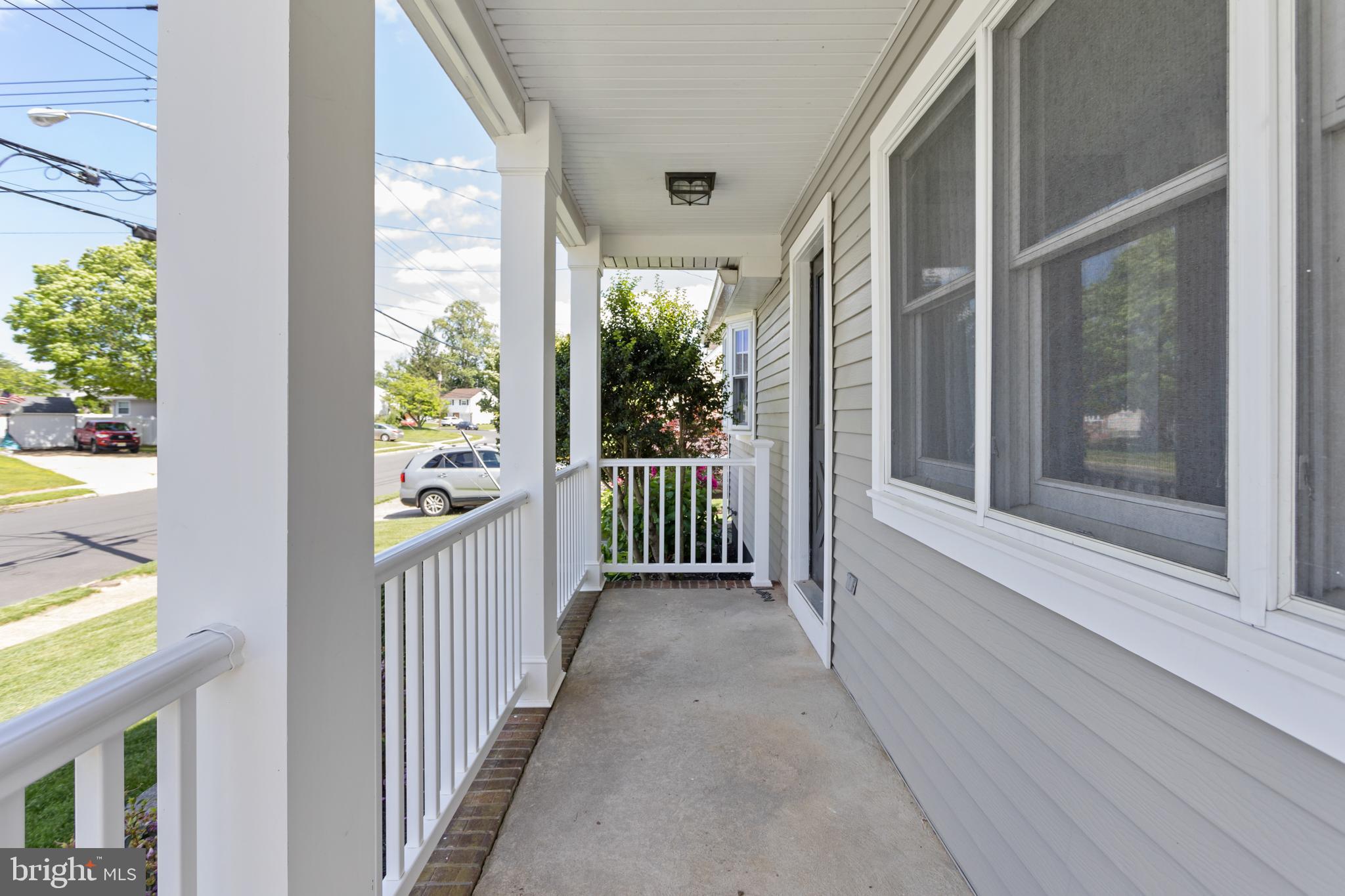 124 Gary Drive Hamilton, NJ 08690 - Photo 4 of 31 a view of a porch with wooden floor