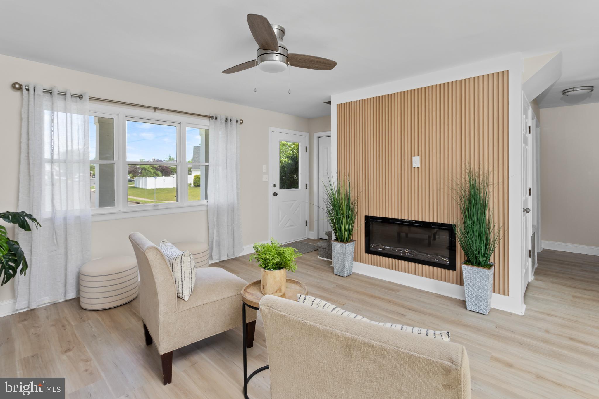 124 Gary Drive Hamilton, NJ 08690 - Photo 5 of 31 a living room with furniture and a fireplace