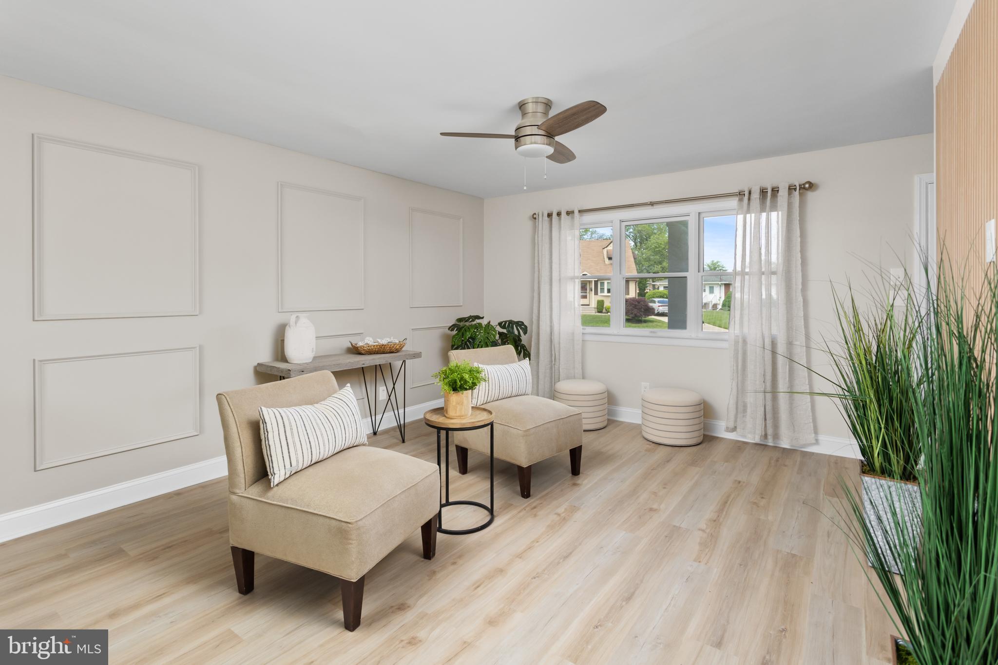 124 Gary Drive Hamilton, NJ 08690 - Photo 7 of 31 a living room with furniture and a large window