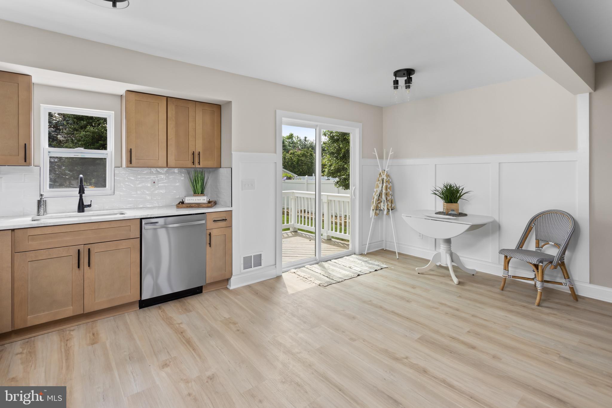 124 Gary Drive Hamilton, NJ 08690 - Photo 10 of 31 a living room with furniture a window and kitchen view