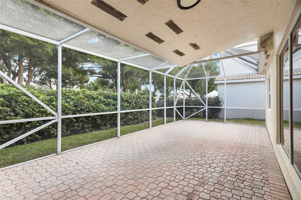 17282 Ventana Drive Boca Raton, FL 33487 - Photo 11 of 23 a view of a room with wooden floor and windows