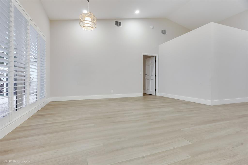 17282 Ventana Drive Boca Raton, FL 33487 - Photo 15 of 23 a view of an empty room with wooden floor and a window