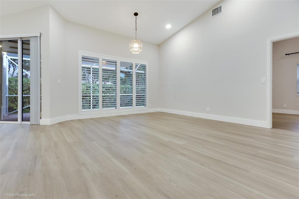 17282 Ventana Drive Boca Raton, FL 33487 - Photo 18 of 23 an empty room with wooden floor and windows