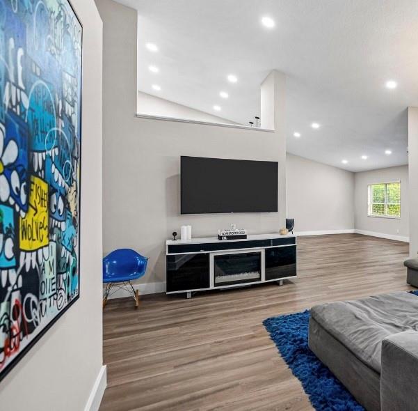 17282 Ventana Drive Boca Raton, FL 33487 - Photo 8 of 23 a living room with furniture and a flat screen tv