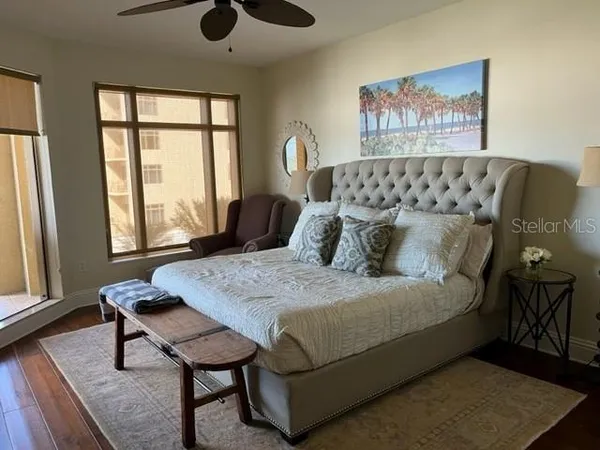 a bedroom with a bed and window