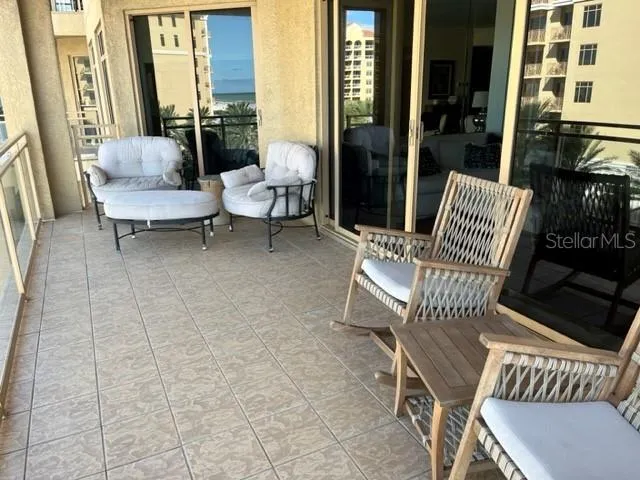 a outdoor living space with furniture and a rug
