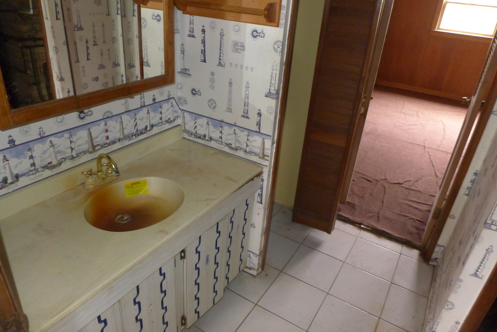 202 Elm Street Prospect Heights, IL 60070 - Photo 15 of 26 a bathroom with a sink and a mirror