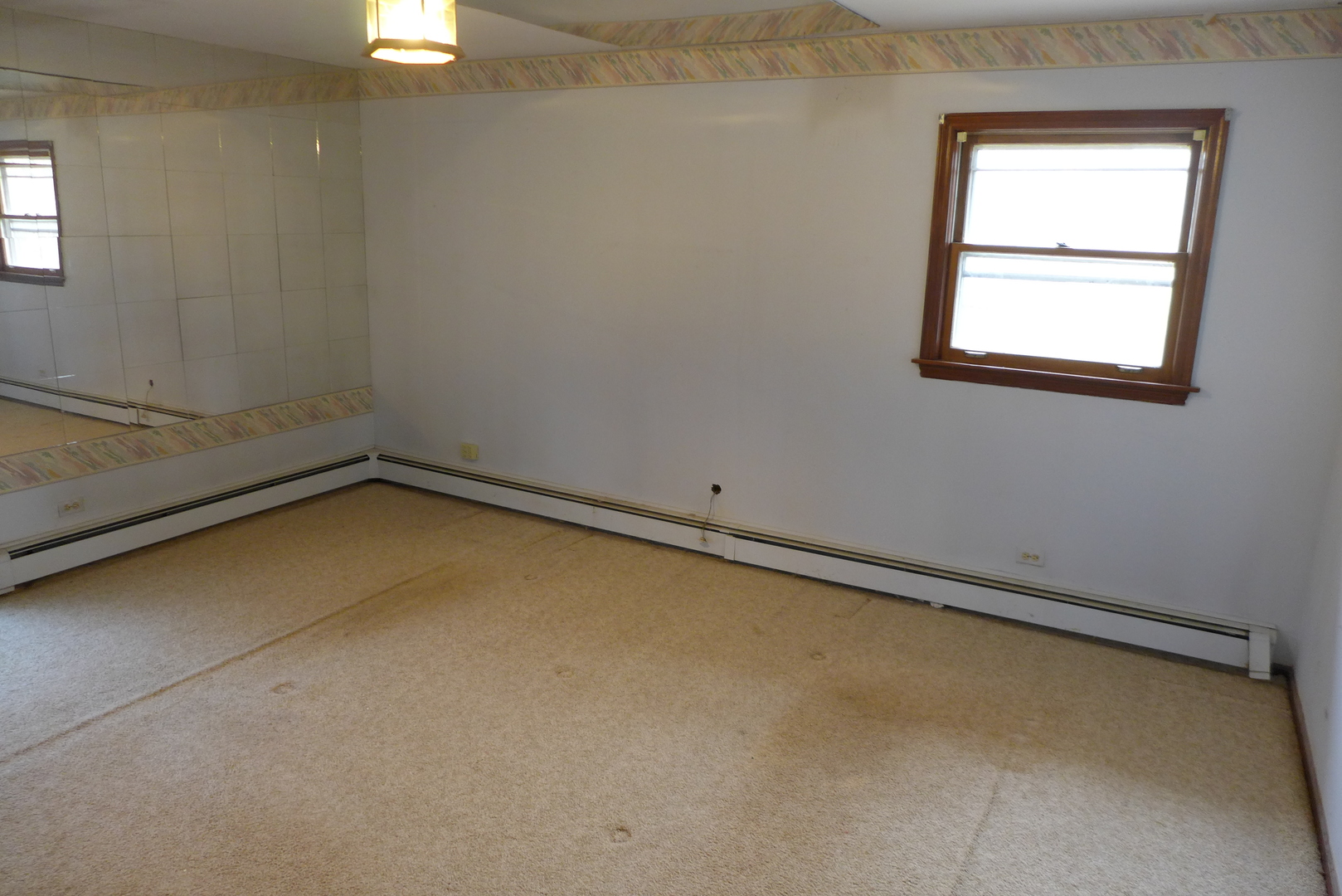 202 Elm Street Prospect Heights, IL 60070 - Photo 23 of 26 an empty room with a window