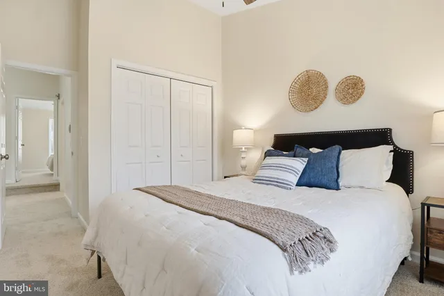 a bathroom with a toilet sink vanity and mirror