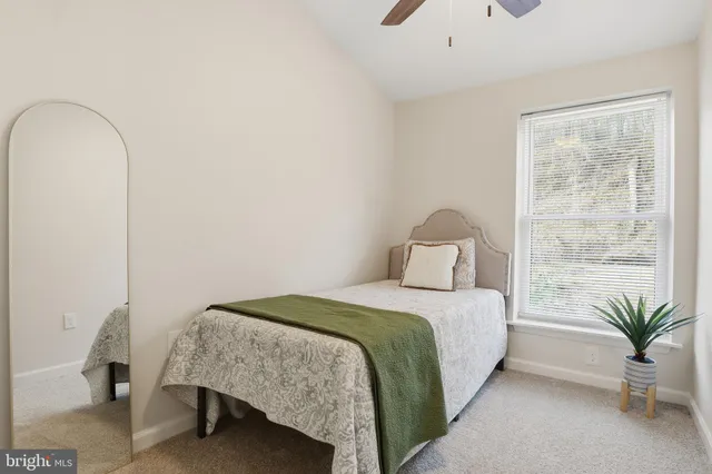 a bedroom with a bed and a table