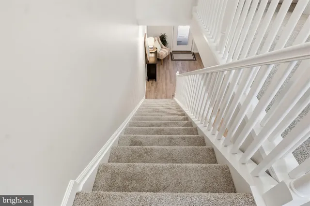 a view of a backyard with wooden fence