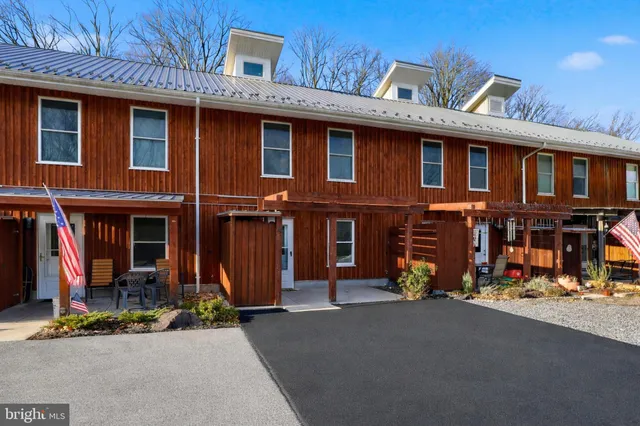 a view of a brick building with many windows