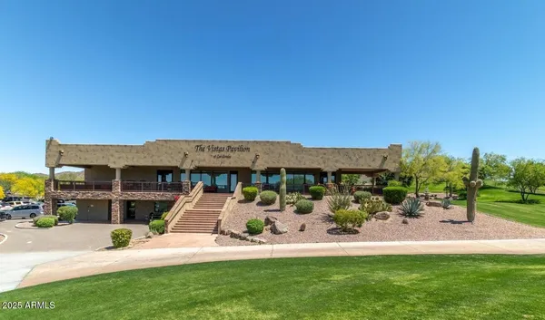a view of a building with sitting area