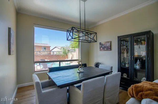 a view of a dining room with furniture window and outside view