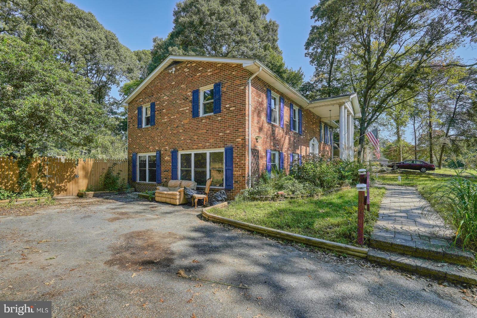 1142 Calvert Beach Road St. Leonard, MD 20685 - Photo 6 of 63 a front view of a house with a yard
