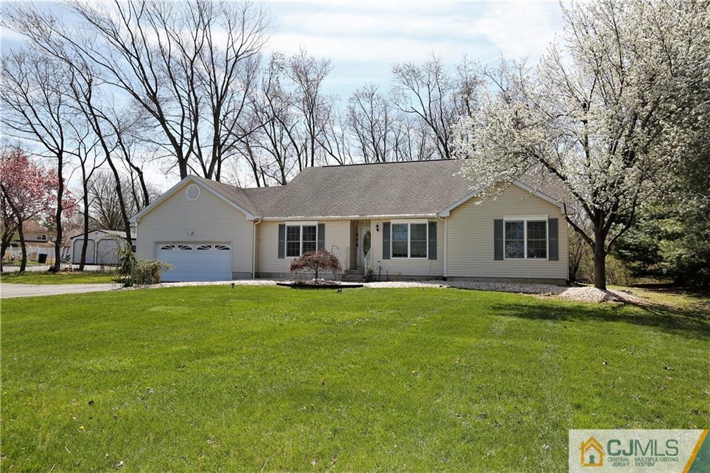 543 Georges Road Dayton, NJ 08810 - Photo 1 of 23 a front view of house with yard and trees