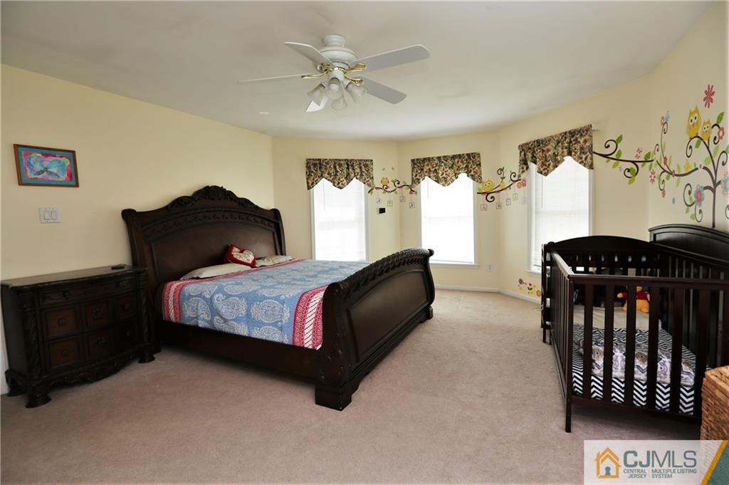 543 Georges Road Dayton, NJ 08810 - Photo 14 of 23 a bedroom with a bed closet and window