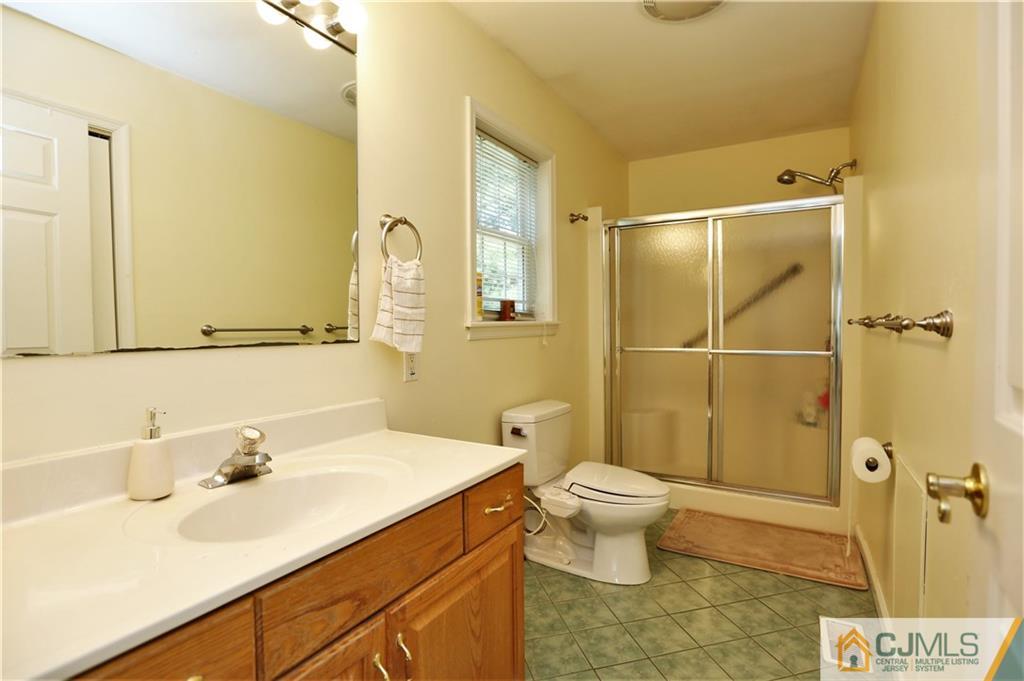 543 Georges Road Dayton, NJ 08810 - Photo 15 of 23 a bathroom with a sink toilet and shower