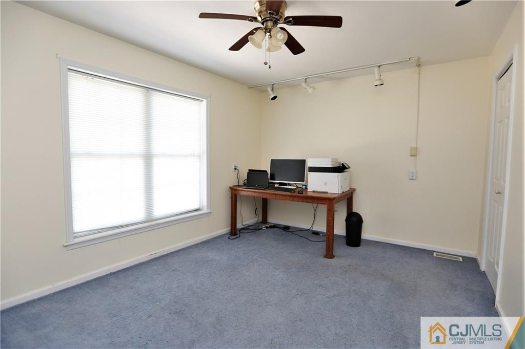 543 Georges Road Dayton, NJ 08810 - Photo 17 of 23 a view of room with a window and a ceiling fan