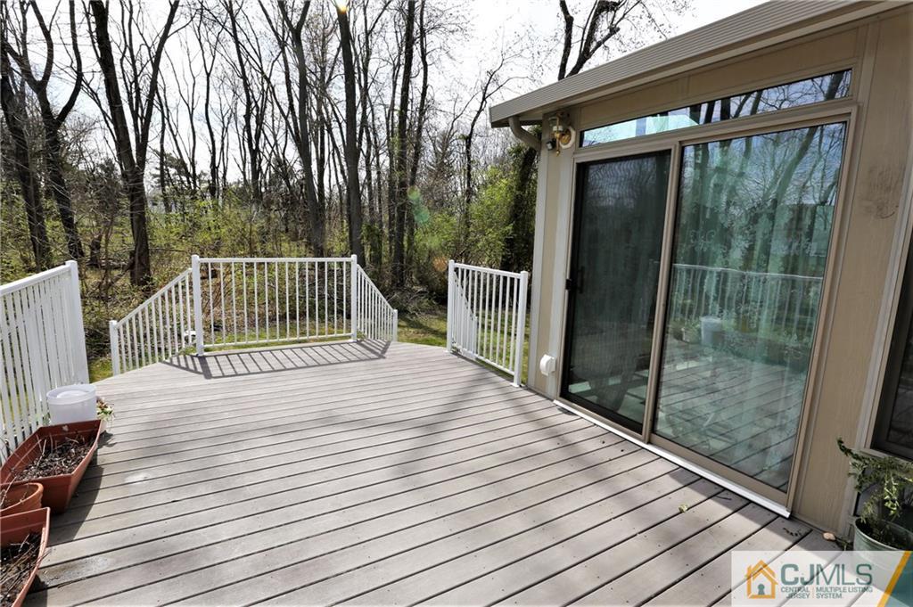 543 Georges Road Dayton, NJ 08810 - Photo 22 of 23 a balcony with view of trees in the background