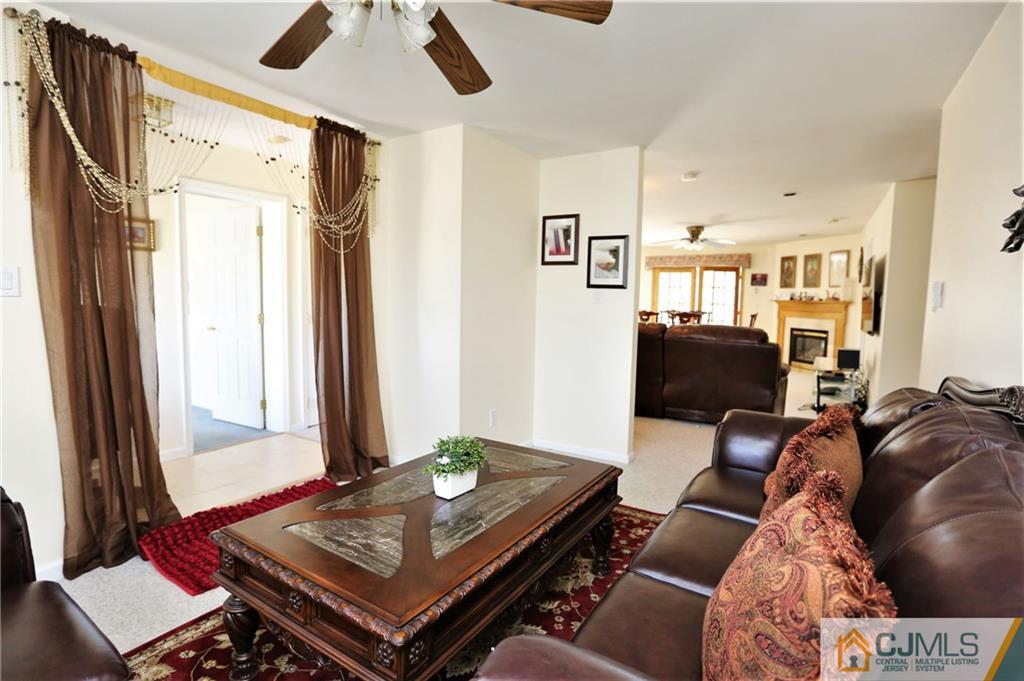543 Georges Road Dayton, NJ 08810 - Photo 6 of 23 a living room with furniture and a window