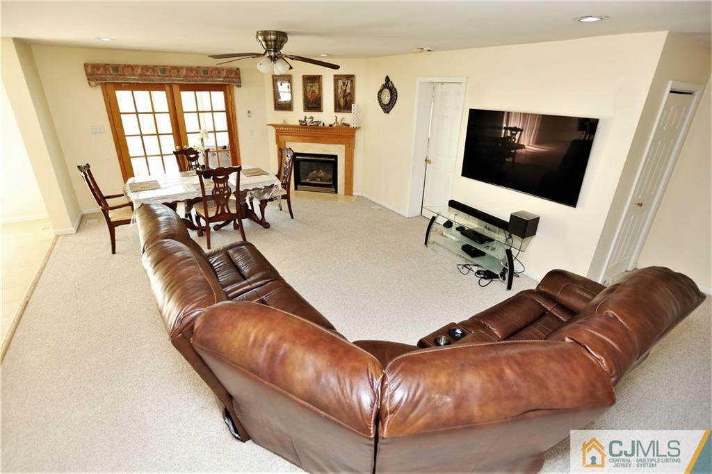 543 Georges Road Dayton, NJ 08810 - Photo 7 of 23 a living room with furniture and a flat screen tv