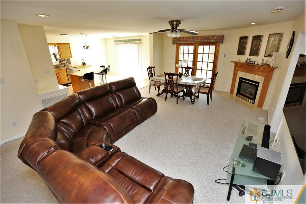 543 Georges Road Dayton, NJ 08810 - Photo 8 of 23 a living room with furniture and a flat screen tv
