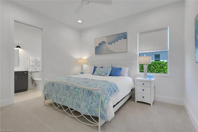 a spacious bedroom with a bed and a couch