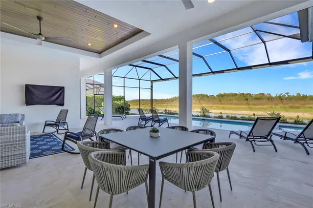 a view of a dining room with furniture window and outside view