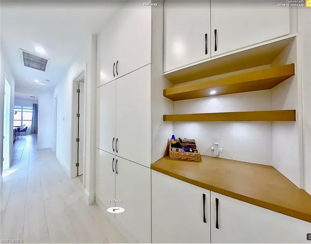 a view of a room and wooden floor