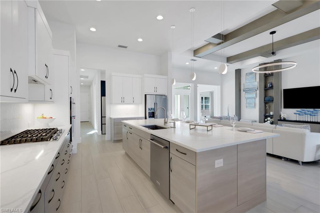 19114 WildBlue Boulevard Fort Myers, FL 33913 - Photo 8 of 50 a kitchen with sink stove and refrigerator