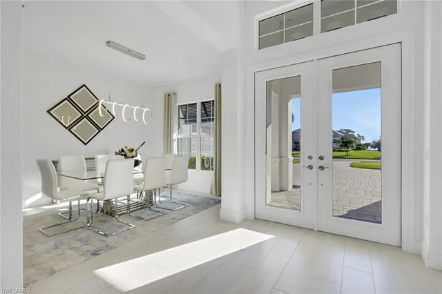 a view of a livingroom with wooden floor and a dining table