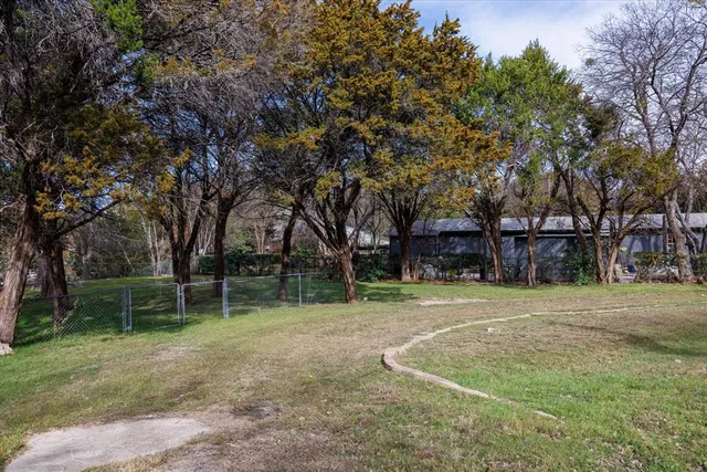 a backyard of a house with lots of green space