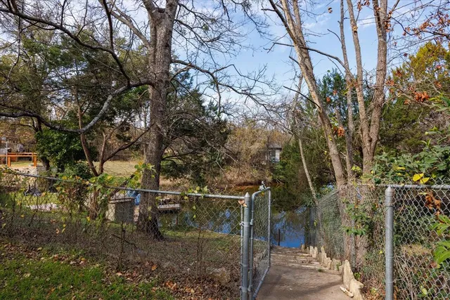 a backyard of a house with lots of green space