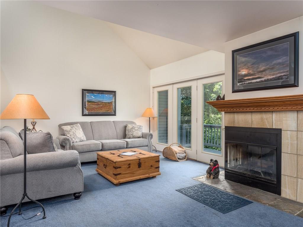 108 Locke Village Road, Unit J3 Newry, ME 04261 - Photo 5 of 32 Sitting area with wood-burning...