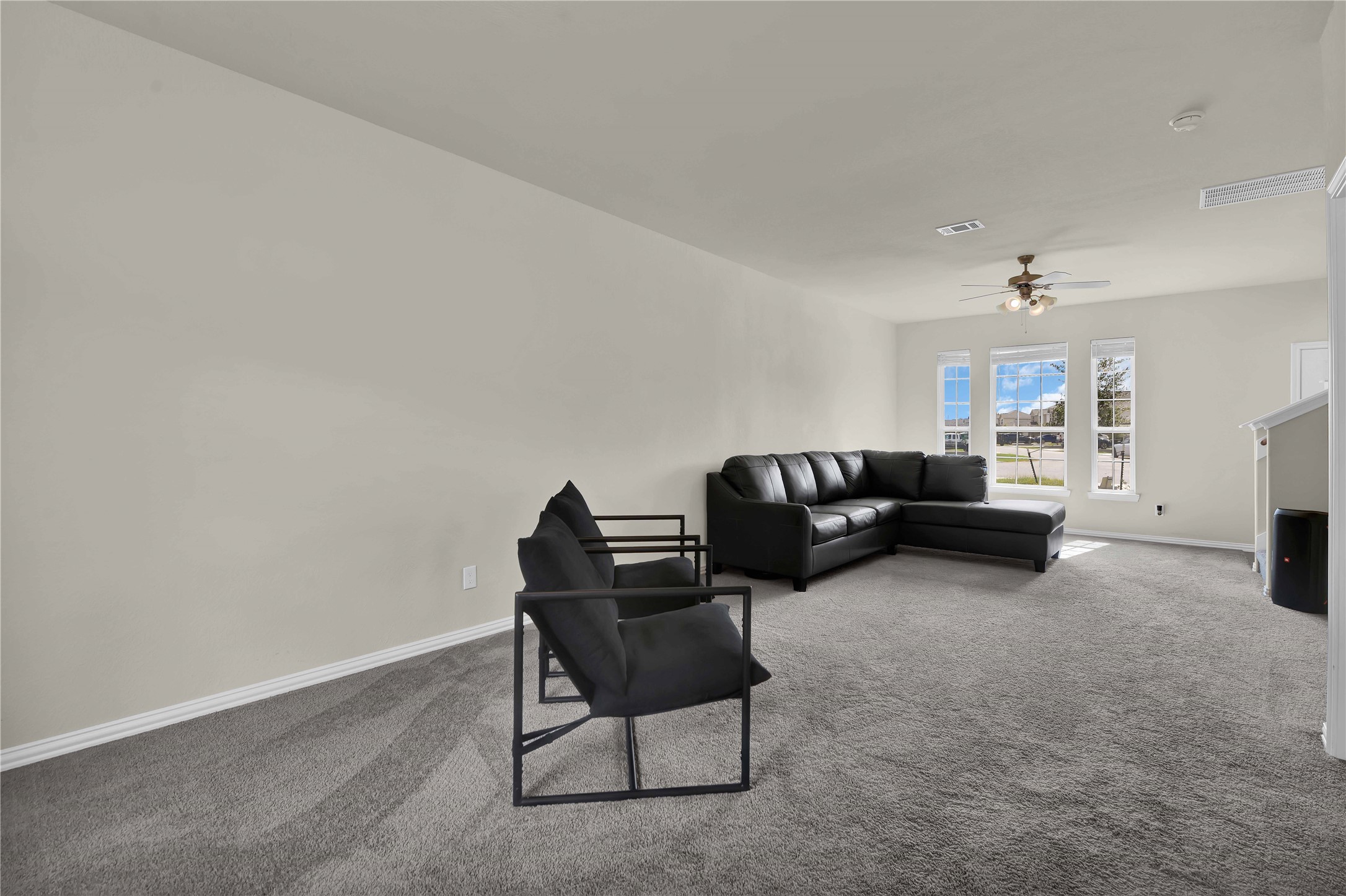 17703 Lion Heart Road Conroe, TX 77306 - Photo 7 of 26 a living room with furniture and a couch