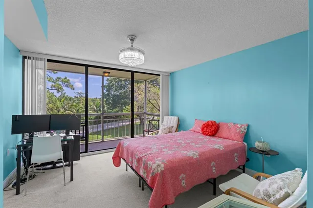 a bed room with a bed and a chair