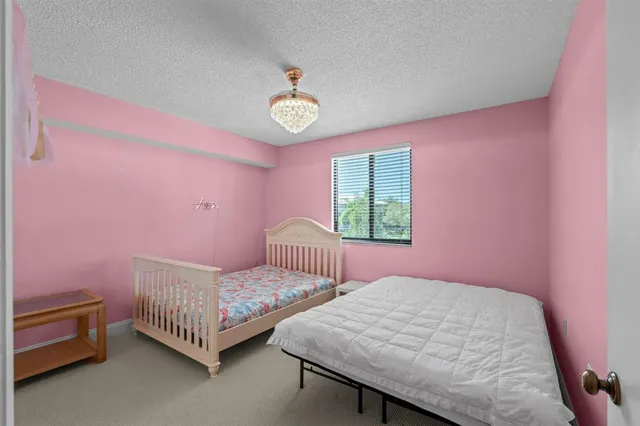 a bedroom with a bed and a table in it