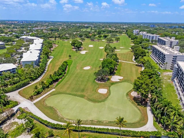 a front view of a building with garden