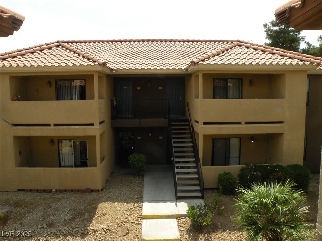 View of property featuring stairway