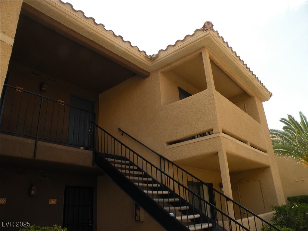 3135 South Mojave Road, Unit 260 Las Vegas, NV 89121 - Photo 15 of 23 View of building exterior featuring stairs