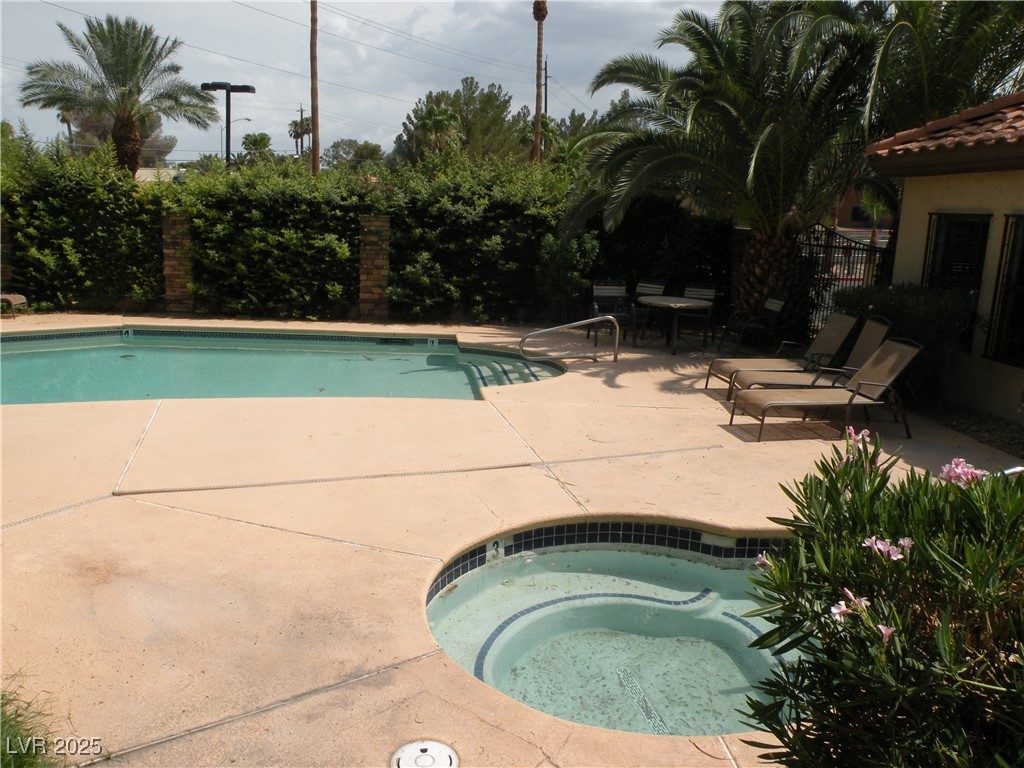 3135 South Mojave Road, Unit 260 Las Vegas, NV 89121 - Photo 21 of 23 Community pool with a patio and a community hot tub
