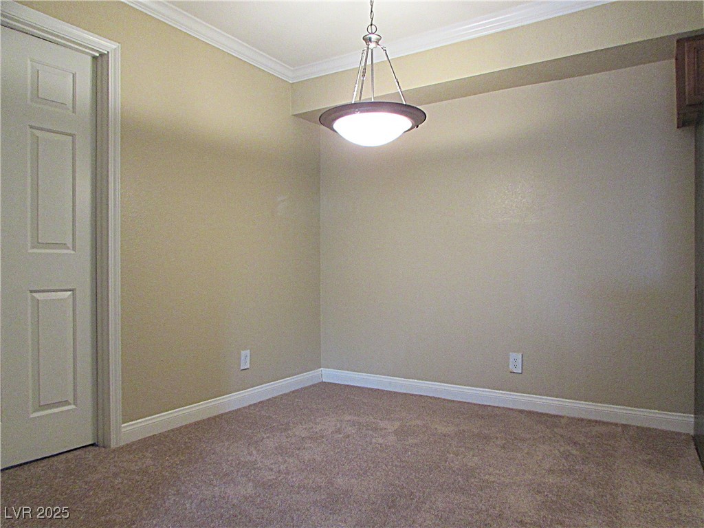 3135 South Mojave Road, Unit 260 Las Vegas, NV 89121 - Photo 8 of 23 Carpeted empty room featuring ornamental molding and baseboards