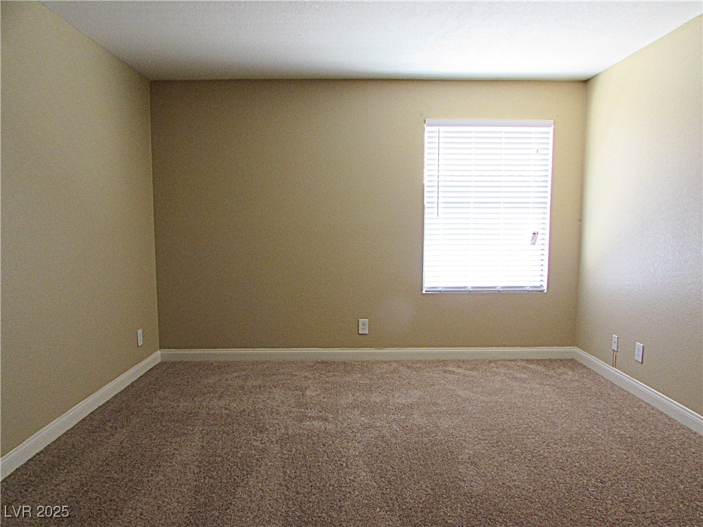 3135 South Mojave Road, Unit 260 Las Vegas, NV 89121 - Photo 9 of 23 Empty room featuring carpet and baseboards