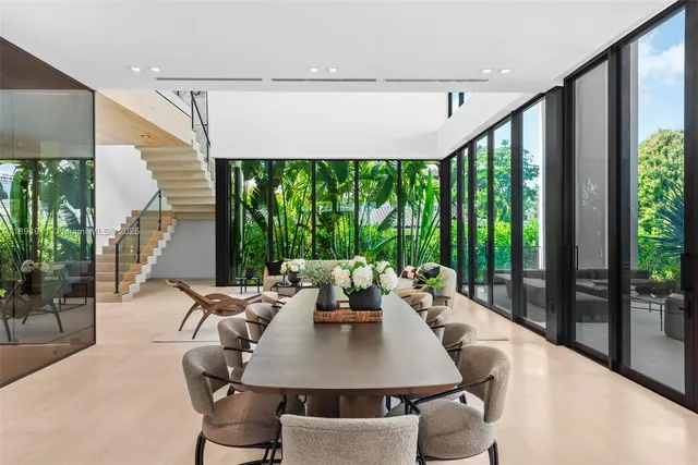 a view of a dining room with furniture and window