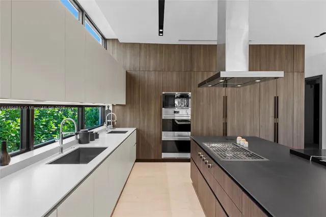 a room with walk in closet and empty racks